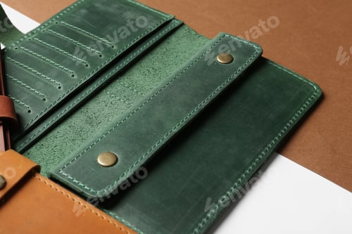 Preview: Open leather wallet on color background, closeup