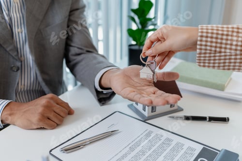 Preview: Two business professionals are discussing real estate investment, signing property contracts