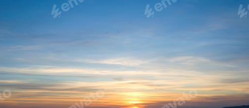 Preview: Mesmerizing view of the sunset in shades of orange on a clear sky