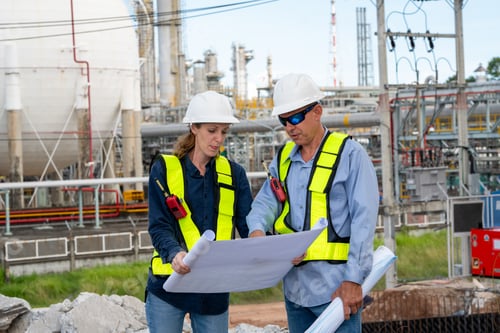 Preview: Team Petroleum chemical engineer discussion about blueprint drawings inside Oil Refiner