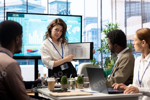 Preview: Accounting manager reviewing budget numbers after all monthly costs