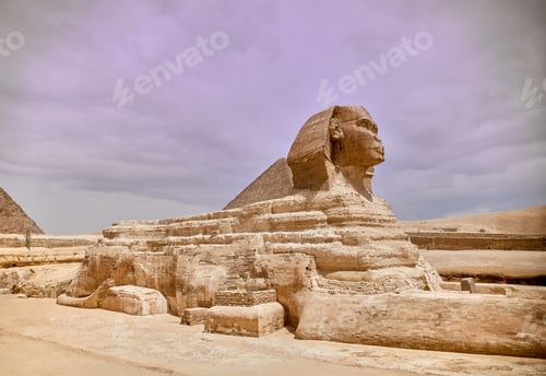 Preview: Majestic sphinx sculpture stands guard in front of the iconic pyramids of Giza, Egypt.