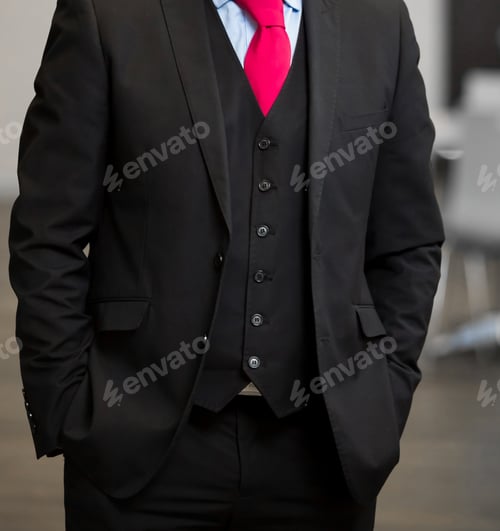 Preview: Selective focus of a businessman in a classic black suit with his hand in the pocket