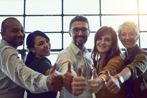 Preview: Portrait of a team of colleagues giving a thumbs up in a modern office