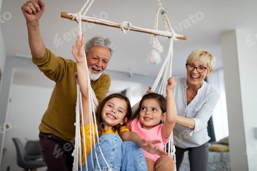 Preview: Grandchildren having fun at home while playing with their grandparents
