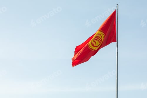 Preview: Kyrgyzstan flag waving on a flagpole