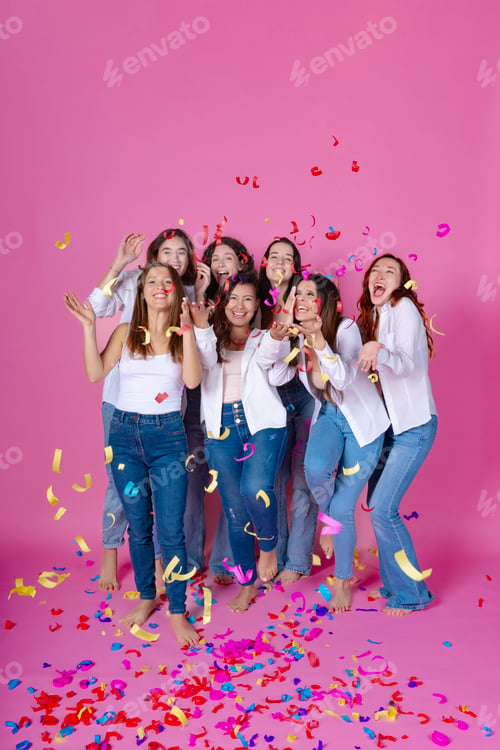 Preview: Joyous friends partying with confetti, pink background.