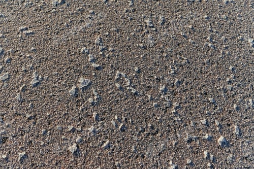 Preview: Top close up view of surface on the beach. Details of colorful soil