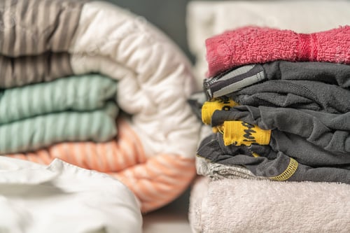Preview: Close-up view of clean laundry folded on a laundry table
