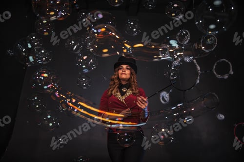 Preview: Female magician makes with soap bubbles show, an illusionist