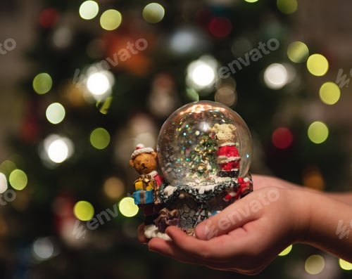 Preview: snow glass ball in the hands