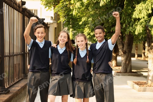 Preview: Teenage students in stylish school uniform outdoors