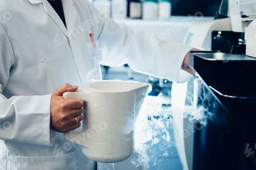 Preview: Scientist conducting an experiment with liquid nitrogen in a laboratory setting.