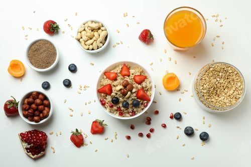 Preview: Bowl of oatmeal and ingredients for cooking on white background