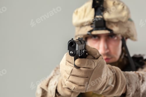 Preview: Soldier points gun at camera in training exercise at military facility
