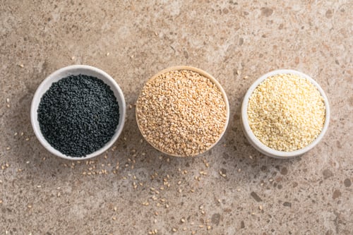 Preview: Set with different sesame seeds on stone background. top view.