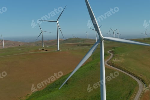 Preview: Aerial drone shot of the windmills in hills for renewable energy