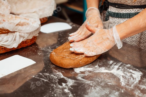 Preview: baker shaping dough for bread