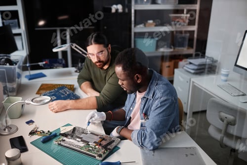 Preview: Workers inspecting computer