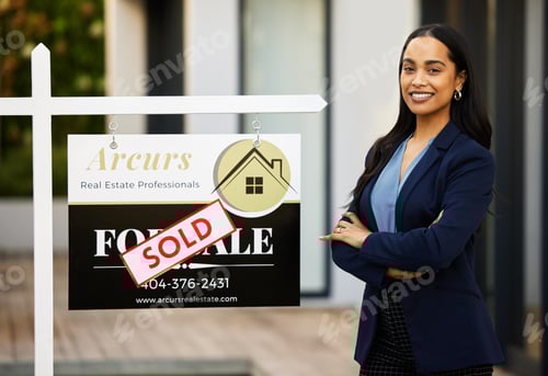 Preview: Real Estate Professional Stands next to Sold Sign