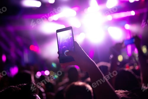 Preview: Portrait of happy crowd enjoying at music festival