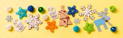 Preview: Top view Banner of yellow background with New Year toys and decorations. Christmas