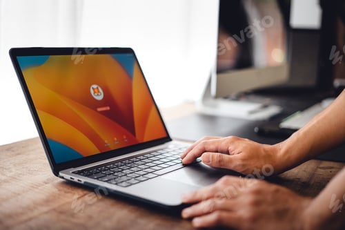 Preview: Close up of businessman working and login on laptop