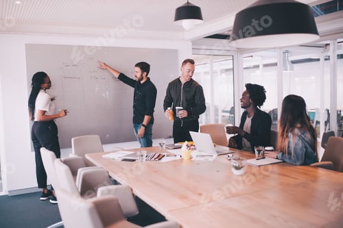 Preview: Young start-up business team working in meeting room