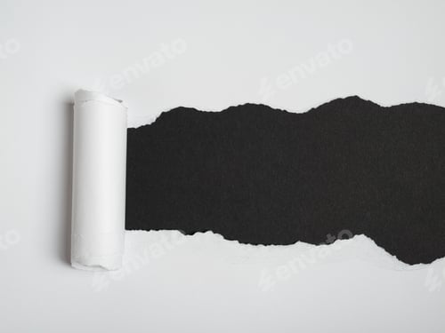 Preview: Torn white paper revealing a black paper background. Space for text
