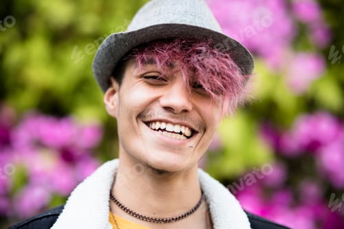 Preview: Portrait of cheerful young boy with alternative violet hair and stylish hat - concept of youthful