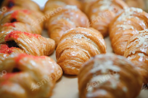 Preview: Croissants in a bakery. Cooking pastries in a pastry shop. French crispy croissants close up