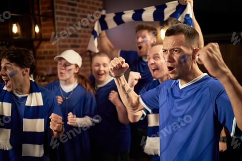 Preview: Group of Diverse Soccer Fans Cheering and Celebrating Championship Victory