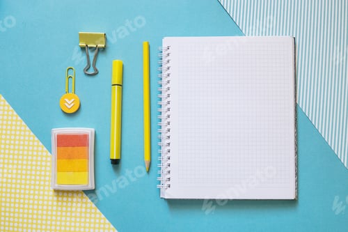 Preview: School supplies. Yellow and blue colors. Empty notebook. Flat lay composition. Space for text.