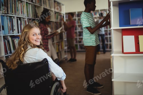 Preview: Disabled girl on wheelchair in library