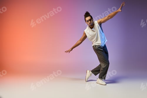 Preview: African american dancer in motion against colorful background