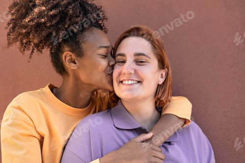 Preview: Female gay couple having tender moments outdoor - Lgbt and love relationship concept