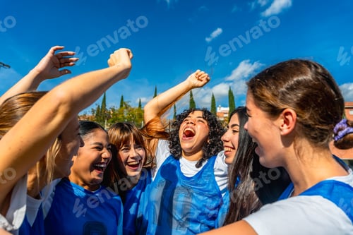 Preview: Women's soccer team celebrating victory together, cheering