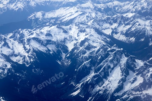 Preview: An Aerial View Above Snowy Mountain Tops
