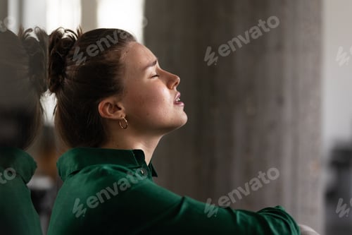 Preview: Young exhausted woman in office, having problem.