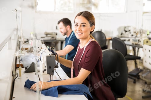 Preview: Pretty seamstress using a sewing machine