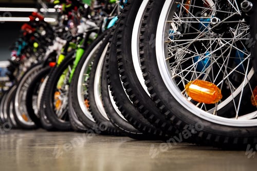 Preview: Bikes in a sports store, tires closeup, bicycle wheels in a row in bikes store