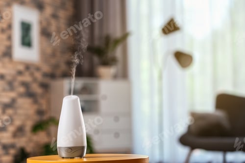 Preview: Aroma oil diffuser on table against blurred background. Air freshener
