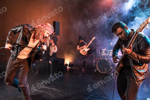 Preview: Young rock and roll band playing hard rock music on stage
