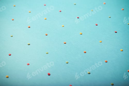 Preview: Small Round Candies Lie On A Bright Background