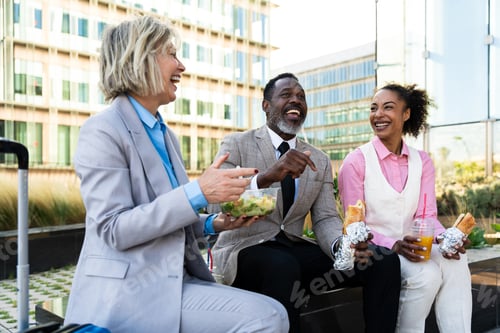 Preview: Group of multiethnic business people meeting outdoors