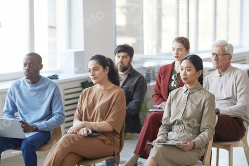 Preview: People Attending a Business Seminar in a Conference Room