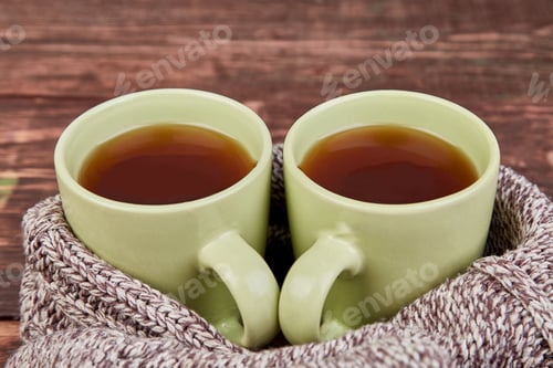 Preview: Two warm cups of tea, autumn leaves