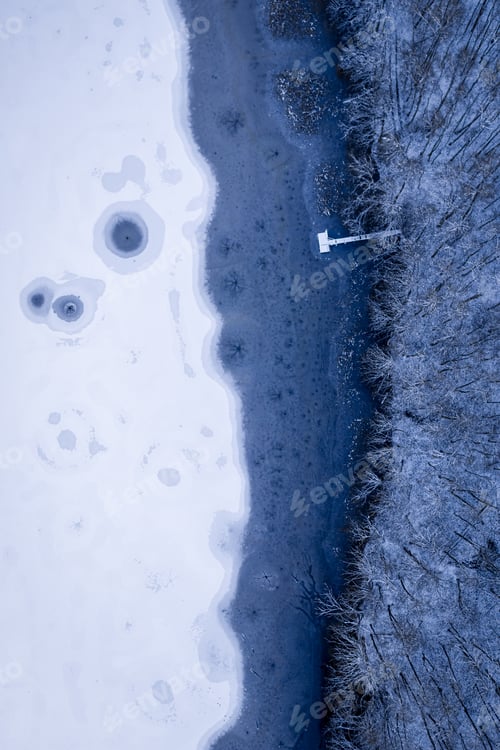 Preview: Ice holes and pier. Winter hobby. Fishing on frozen lake.