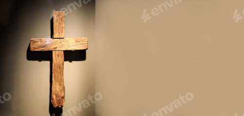 Preview: wooden cross is displayed against a textured wall, symbolizing the Passion of Jesus