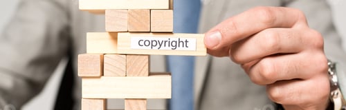 Preview: partial view of businessman near blocks wood tower game with copyright inscription isolated on grey